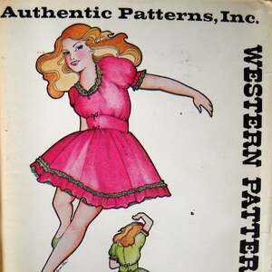 May include: An Authentic Patterns, Inc. Western Patterns 261 sewing pattern envelope featuring a blonde figure in a pink dress with green ruffled trim and a smaller figure in a green dress with pink ruffled trim, both with short puff sleeves.