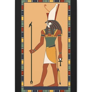 May include: A rectangular wall art print featuring an Egyptian deity with a falcon head, wearing a white crown, a green patterned chest piece, and a yellow kilt. The figure holds a tall staff and an ankh symbol, framed by a colorful border.