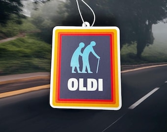 May include: A rectangular air freshener with a white string for hanging. The design features a blue silhouette of two elderly people, one with a cane, inside a navy blue rectangle. The word "OLDI" is in white.