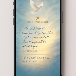 May include: A smartphone screen shows a digital image with a dove and text. The text reads "Your Daily Light" and a Bible verse from Matthew 6:33. The background is a gradient of blue and yellow.