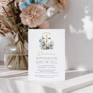 May include: A white invitation card with gold text and a gold cross surrounded by blue and green floral elements. The card includes the text "TERVETULOA" and "Oliverin RIPPIJUHLIIN". A bouquet of flowers is in the background.