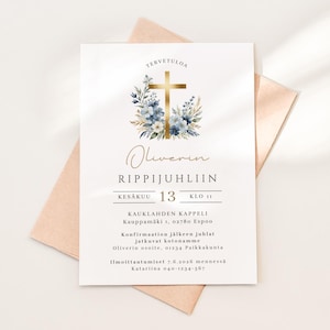 May include: A white invitation card with gold text and a gold cross adorned with blue and white flowers. The card includes the text "Oliverin RIPPIJUHLIIN" and event details. The card is placed on a peach-colored envelope.