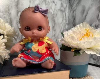 Vintage Berenguer Baby Doll 06-11, Collectible with Handmade Floral Dress & Purple Bow
