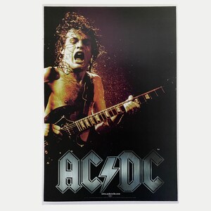 Plakat promocyjny Angus Young z epoki AC/DC