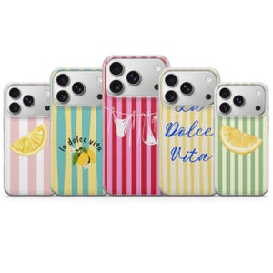 May include: Five phone cases with colorful striped designs. Each case features a different design, including lemon slices, the phrase "la dolce vita", and a clothesline with white garments. The cases have a clear border.