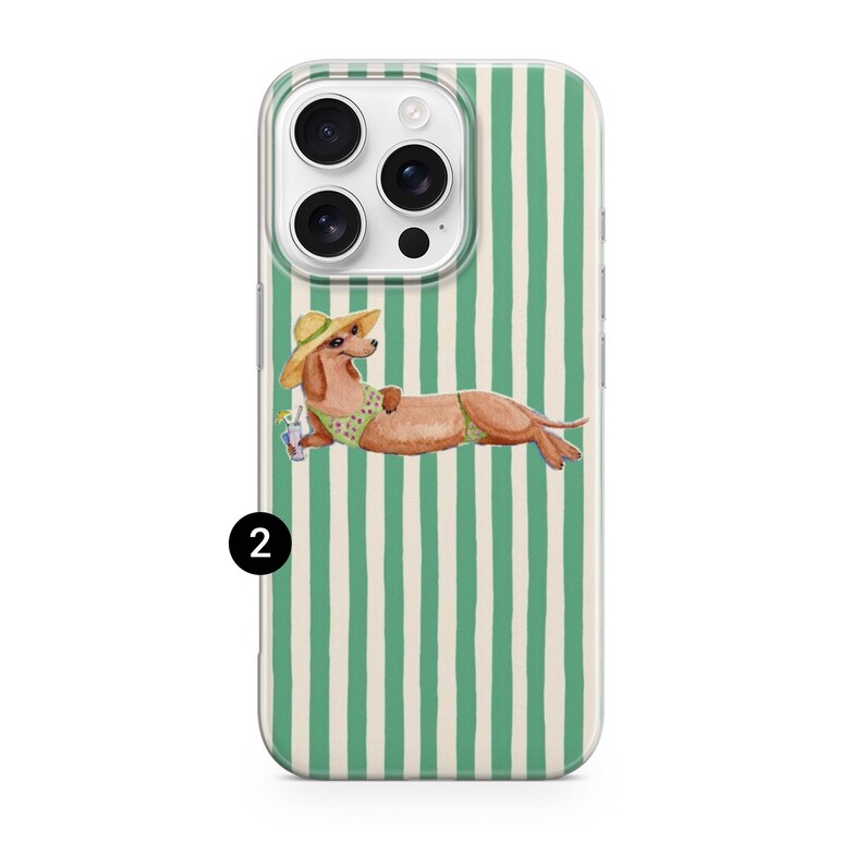 May include: A clear phone case with a green and white striped design. The case features a watercolour illustration of a dachshund wearing a sun hat and swimsuit, holding a drink. The dog is lounging on the case.