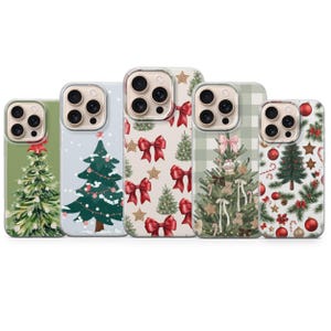 May include: Five phone cases with Christmas designs. The cases feature festive patterns including Christmas trees, bows, ornaments, and stars. The colour palette includes green, red, white, and gold, creating a holiday aesthetic.