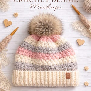 May include: A crochet beanie mockup with a cream, pink, and gray striped pattern, topped with a fluffy brown pom-pom. The hat features a ribbed brim and a small heart-shaped tag. The image includes text: "CROCHET BEANIE Mockup."