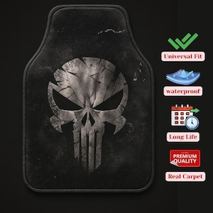 May include: Black car floor mat featuring a distressed skull graphic. The mat is rectangular with rounded edges. The image also includes icons indicating universal fit, waterproof, long life, premium quality, and real carpet.