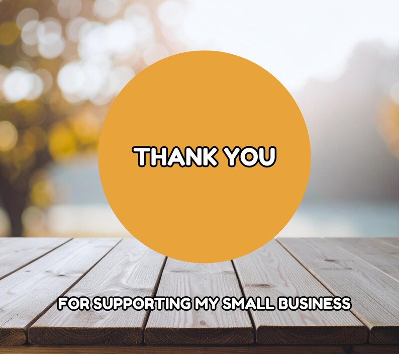 May include: An image with a wooden table in the foreground and a blurred background. A large orange circle in the center displays the words "THANK YOU" in a bold, black font. Below, the text reads "FOR SUPPORTING MY SMALL BUSINESS."