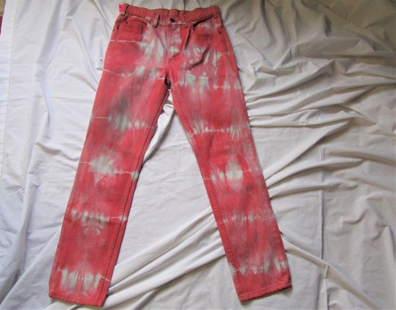 red tie dye jeans