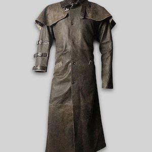May include: A long, brown leather coat with a cape-like shoulder design. The coat features a button-down front, a collar, and three buckle straps on the left sleeve. The coat is a full-length garment.