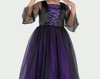 May include: A black and purple witch costume. The dress features a black bodice with a purple corset and a layered tulle skirt. A black witch hat with purple accents completes the outfit. Ideal for Halloween or fancy dress.