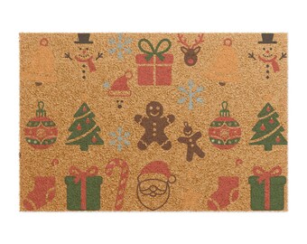 May include: A rectangular doormat with a brown background and festive Christmas designs. The mat features images of a snowman, bell, gift, reindeer, Christmas tree, gingerbread man, ornament, stocking, candy cane, and Father Christmas.