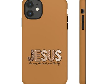 May include: A tan phone case with the word "JESUS" in a decorative font. The letter "J" has a leopard print design, and the letters "E" and "S" have a polka dot design. The text "the way, the truth, and the life" is below.