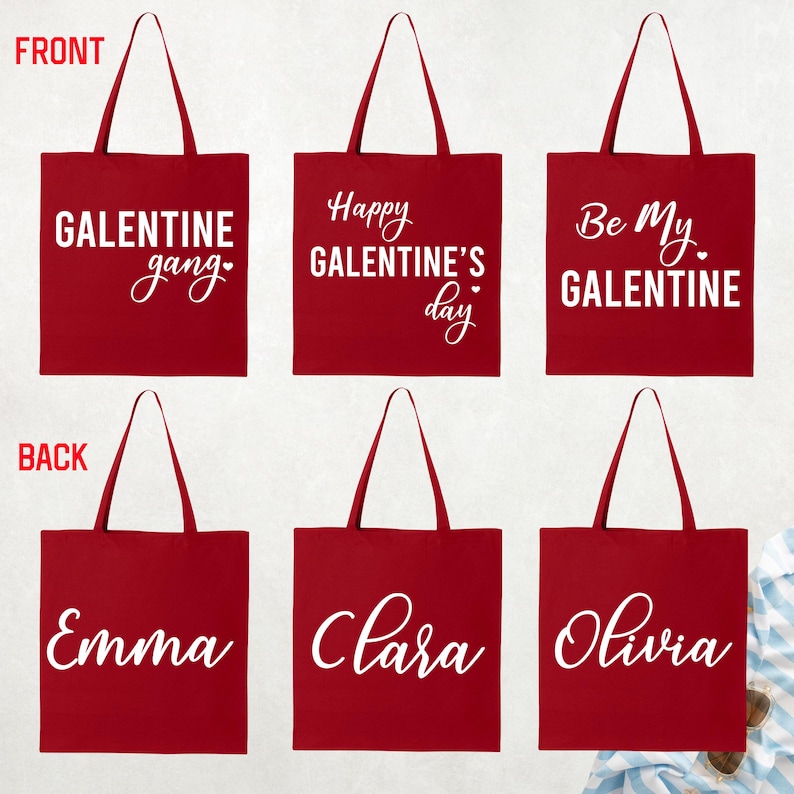 May include: Red tote bags with white text. The front of the bags say "GALENTINE gang", "Happy GALENTINE'S day", and "Be My GALENTINE". The back of the bags say "Emma", "Clara", and "Olivia".