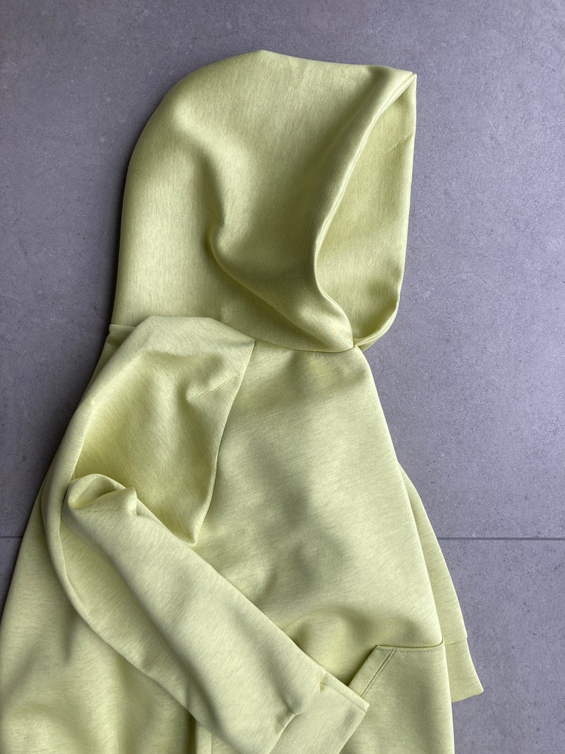 Side close up. Oversize hoodie. Without logos. Color citric yellow