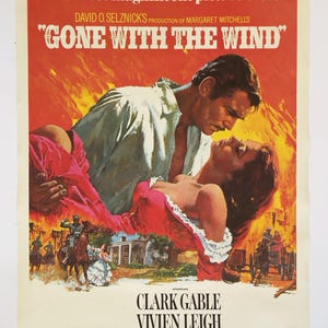May include: A vintage movie poster for "Gone With The Wind" featuring Clark Gable and Vivien Leigh. The poster has a red and orange background with the film's title and actors' names. The image shows a man holding a woman in a passionate embrace.