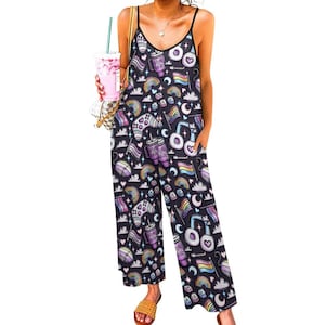 May include: Black jumpsuit with a colorful pattern of rainbows, hearts, flags, and game controllers. The jumpsuit has a V-neck, spaghetti straps, and pockets. The overall design is a fun and vibrant statement piece.