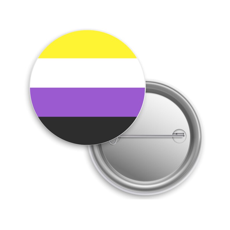 May include: A round button pin with a non-binary pride flag design. The flag features horizontal stripes in yellow, white, purple, and black. The pin is made of metal and has a safety pin back.