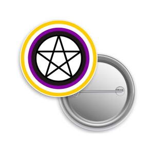 May include: A round button pin with a white background. The pin features a black pentagram inside a circle with a yellow, white, and purple border. The pin is made of metal and has a safety pin on the back.