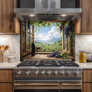 May include: A kitchen splashback depicting a vineyard scene framed by a wooden window. A bottle of red wine and a glass of wine are on the windowsill, with grapes and vines. The kitchen features a stainless steel cooker and wooden cabinets.