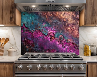 May include: A rectangular kitchen backsplash panel featuring a vibrant, abstract textured pattern in shades of deep magenta, teal, and copper. The surface displays a weathered, metallic appearance with irregular, craggy details.