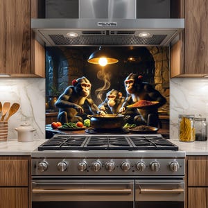 May include: A kitchen backsplash featuring a whimsical scene of three monkeys cooking. The monkeys are gathered around a pot, with vegetables and spices nearby. The background depicts a stone-walled kitchen with a warm, inviting glow.