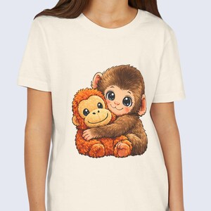 Baby Monkey Punch Youth T-Shirt – Funny & Cute Graphic Tee for Kids
Get ready for giggles and smiles with our Baby Monkey Punch Youth Shirt! This playful t-shirt features an adorable baby monkey holding a plush toy, perfect for kids who love funny animal designs. Inspired by viral animal memes, this shirt brings a mix of humor and cuteness that your little one will love wearing every day.