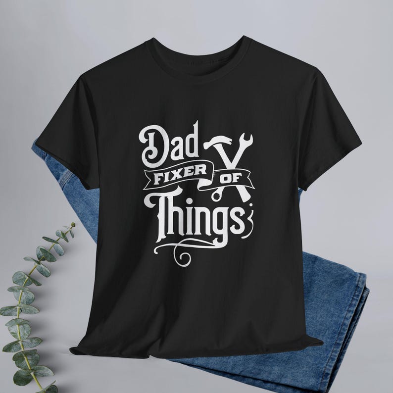 This “Dad Fixer Of Things” shirt is the perfect mix of humor and truth, making it an easy win for Father’s Day, birthdays, or just because he’s the go-to problem solver in the house. Whether he’s in the garage, tackling weekend projects, or proudly refusing to call a professional… this tee says it all.

Perfect Gift For:
Father’s Day
Husband from wife
New dads / first Father’s Day
Handy, DIY-loving dads
Mechanics, builders, and fix-it pros
The dad who already has everything