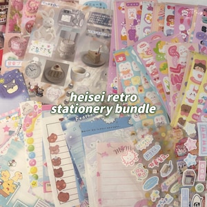 May include: A selection of colourful stationery items, including stickers, notepads, and decorative papers. The bundle features a variety of designs, such as cute animals, cakes, and Japanese text. The text "heisei retro stationery bundle" is visible.