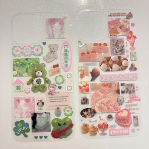 May include: Clear phone case decorated with various stickers. The stickers include a green teddy bear with a four-leaf clover, pink cakes, and Japanese text. Other stickers include a pink-haired anime girl and a frog playing a guitar.