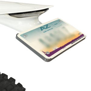 May include: A license plate from Arizona, with the letters "AZ" and the words "Grand Canyon State" visible. The plate has a colorful design with a purple and orange gradient. The plate is mounted on a vehicle.