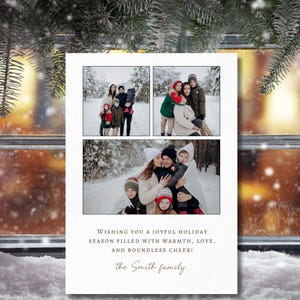 May include: A holiday greeting card featuring three family photos in a snowy outdoor setting. The card includes the text "Wishing you a joyful holiday season filled with warmth, love, and boundless cheer!" and the family name.