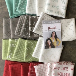 May include: A collection of folded fabric squares in various colors, including teal, gray, green, and red. Some fabrics feature geometric patterns, text, and architectural designs. A card with the title "Flourish" and images of two women is included.
