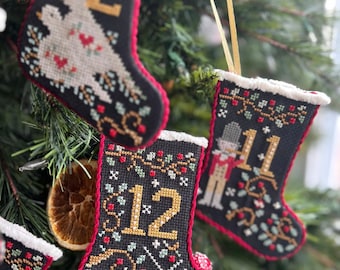 New! ANNIE BeEZ FOLK ArT 12 Days of Christmas Stockings counted cross stitch patterns at cottageneedle.com 2024 Nashville Market