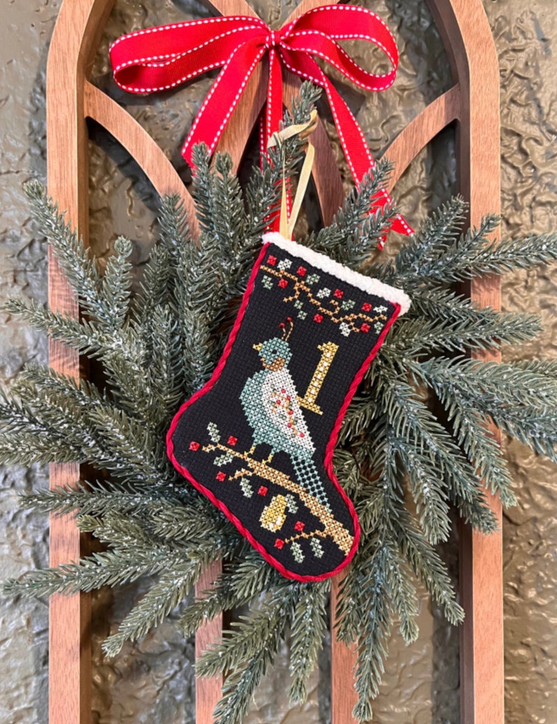 New ANNIE BeEZ FOLK ArT 12 Days of Christmas Stockings counted cross stitch patterns at cottageneedle.com 2024 Nashville Market image 3