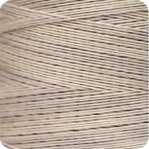 May include: Close-up of a spool of natural-colored linen thread.
