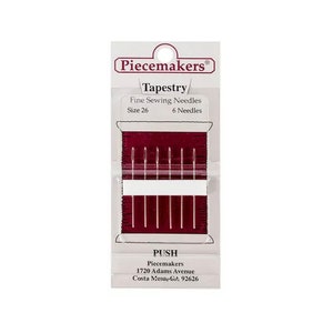 May include: A package of Piecemakers Tapestry fine sewing needles, size 26, containing 6 needles. The needles are displayed on a burgundy-colored card with the brand name and product details printed in white. The package includes the text "PUSH".