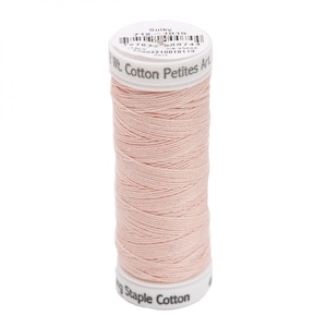 May include: A spool of Sulky Cotton Petites Art thread in a soft, pale pink color. The label includes the text "Sulky", "Cotton Petites Art", and other product information. The thread is tightly wound on a white spool.