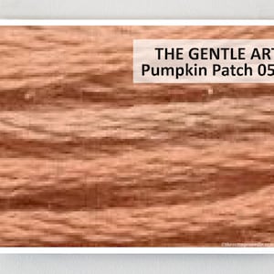 May include: A close-up of a textured, orange-brown fabric with a subtle, wavy pattern. The text "THE GENTLE ART Pumpkin Patch 0530" is printed in white at the top of the image.
