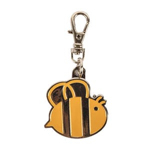 May include: A yellow and black bee keychain with a silver metal clip.