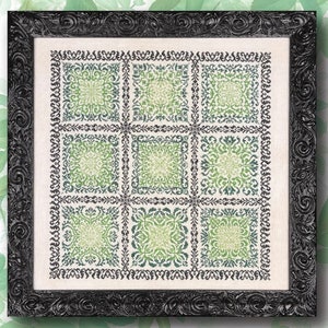 May include: A framed cross-stitch embroidery with nine squares featuring a repeating pattern of green and black floral designs.