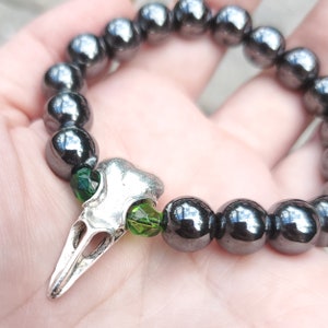 Crow Skull Bracelet with Green Eyes, Raven Skull Jewelry, Gothic Bracelet w/ Skull Charm, Hematite Beads, Unisex Bracelet, Stretch Bracelet