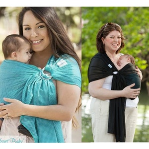 Puede incluir: Se muestran dos portabeb&eacute;s. Uno es turquesa con un patr&oacute;n de puntos, el otro negro. Ambos tienen un anillo met&aacute;lico y est&aacute;n dise&ntilde;ados para llevar a un beb&eacute;. El texto "Beachfront Baby" es visible en la parte inferior.