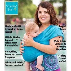 May include: A turquoise blue baby wrap carrier with a white polka dot pattern. The wrap has wide straps that conform to the wearer's shoulders. The wrap has serged edges and a safety label on the tail. The wrap is made in the US by work-at-home moms. The wrap has a middle marker tag and a hidden CPSIA tracking label. The wrap is lab tested and free of nasty chemicals. The wrap is shown being worn by a woman with a baby.