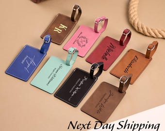 May include: A collection of personalized luggage tags in various colors, including brown, pink, blue, and black. Each tag features a name or initials, with a buckle strap for attachment. The text "Next Day Shipping" is at the bottom.