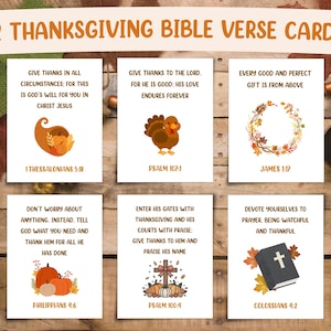 May include: Set of 12 Thanksgiving Bible verse cards. Each card features a different verse with corresponding illustrations of a cornucopia, turkey, wreath, pumpkins, cross, and a book. The cards are on a wooden surface.