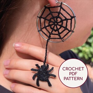 May include: Black crochet spider web earrings with a dangling spider ring. The earrings are attached to a silver hoop. The image also includes a crochet spider ring. The text "CROCHET PDF PATTERN" is in a white circle.
