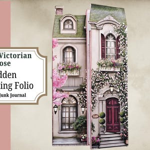 May include: A decorative journaling folio in the shape of a Victorian house. The facade is painted in soft pink and white, with climbing roses and window boxes filled with flowers. The text "Spring Victorian Rose Hidden Journaling Folio" is displayed on the left.